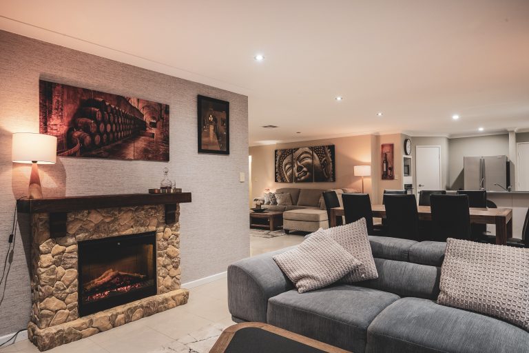 Stylish open-plan living area with modern furniture and natural light in a Tapping family home on Oriole Way
