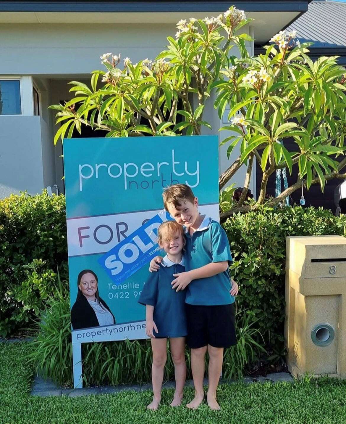 Property North Family Beside A Sold Sign