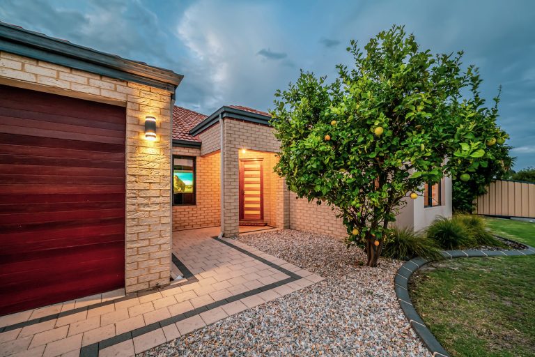 Stylish open-plan living area with modern furniture and natural light in a Tapping family home on Oriole Way